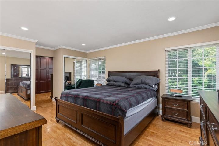 The spacious owner's suite has 2 closets, and in this case has integrated one of the bedrooms as an expanded master closet.