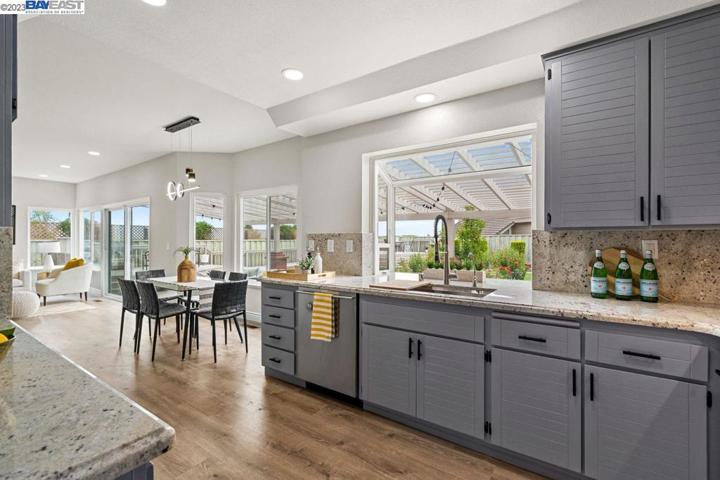Large area to entertain, relax, and enjoy food. Open concept with access to backyard.