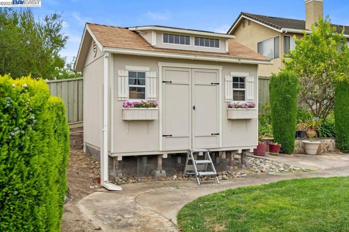 Shed features solar energy, fan, and light. Convert into playhouse-office-he/she shed.