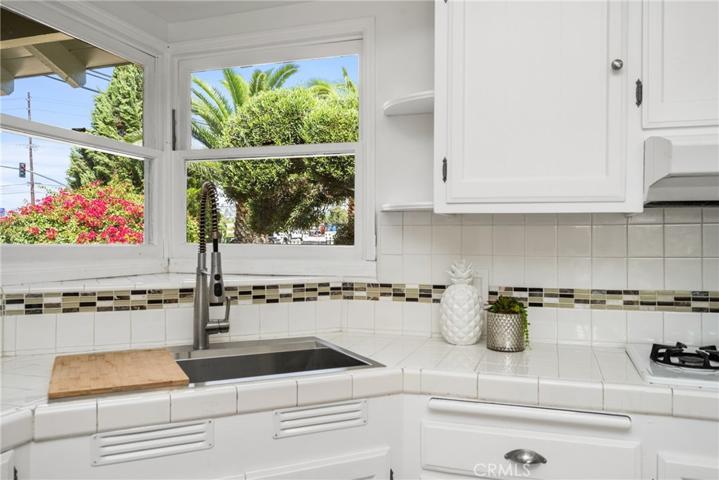 Kitchen sink looks out to front yard