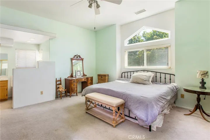 Primary Bedroom with new window and Vaulted Ceiling
