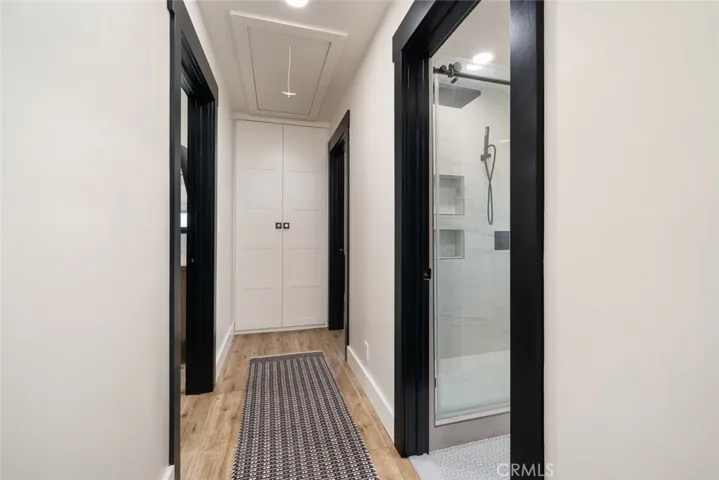 Main home hall with attic access and closet