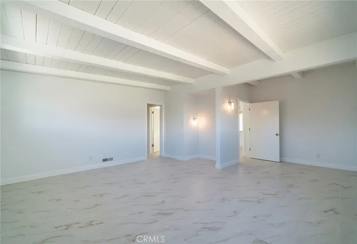 Main bedroom to walkin closet, bathroom and doorway to hallway and kitchen