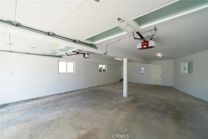 Four car garage with entrance to the home