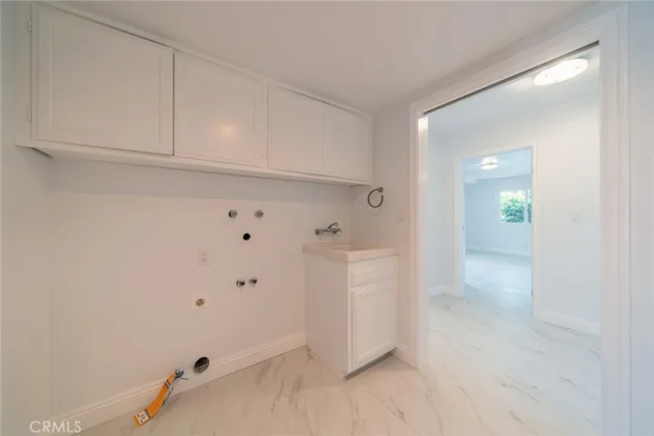 Laundry room to downstairs bedroom