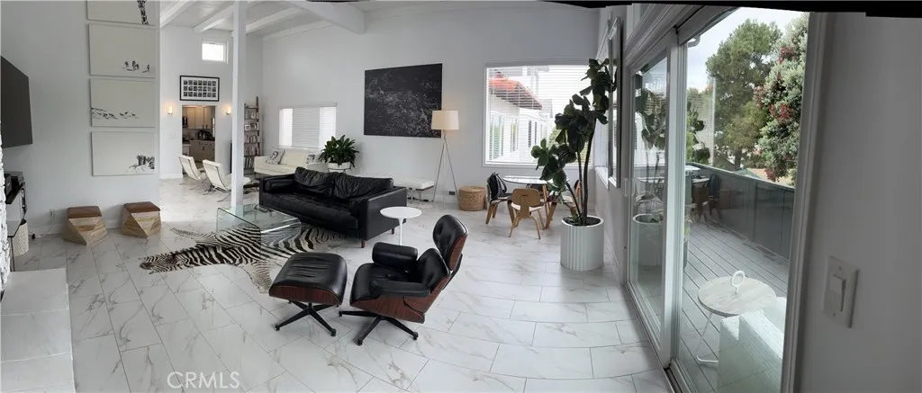 View from the corner of the living room with balcony view showing the 90 foot lot size difference versus the neighbors lot size