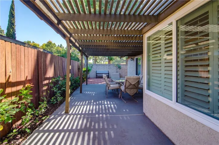 Step out to your side covered patio