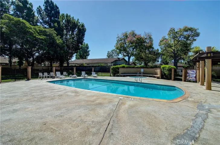 Sunsplashed community pool and jacuzzi area
