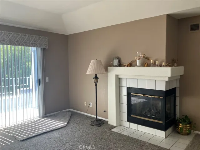 Warm those cool nights with this corner fireplace visible from all areas of the main living space!  New carpet, new blinds, fresh paint.