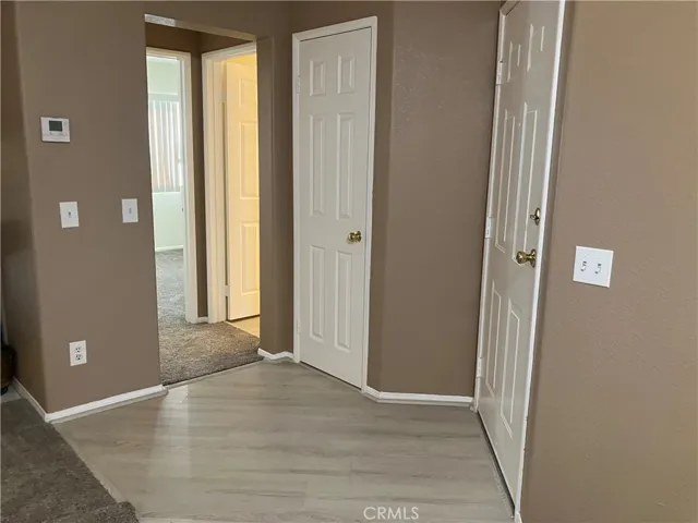 Entry Way leads to right towards Utility closet, linen closet, bathroom and second bedroom