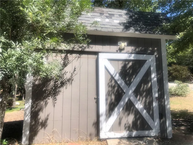 Barn door style shed
