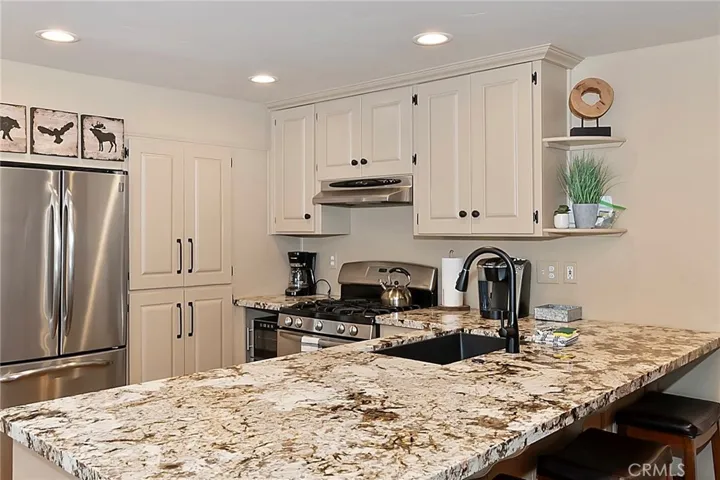 Granite counter top offers additional bar stool seating