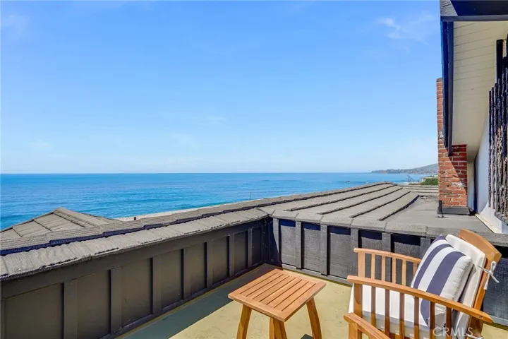 Private upper level deck with prime coastline views.