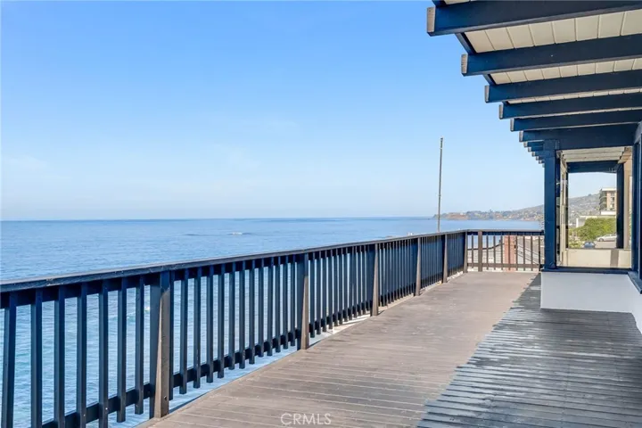 Spacious primary level deck with beautiful coastline views.