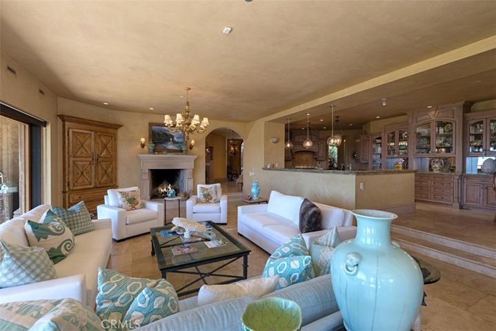 Family Room looking back to open kitchen area.  Kitchen has white Quartz countertops.