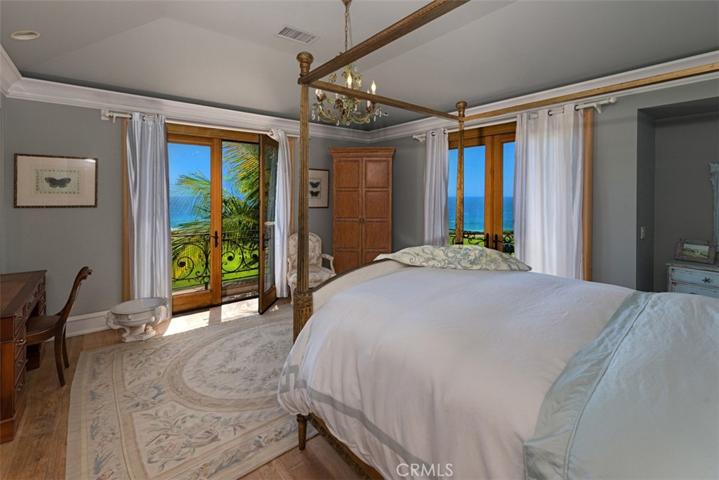Guest Bedroom also with spectacular ocean views.  Porch doors can be opened for the breeze.   Enjoy Catalina views and spectacular sunsets.  Watch surfers.