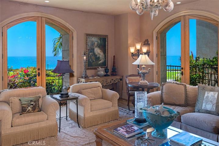 Living Room with beautiful ocean views, white water.