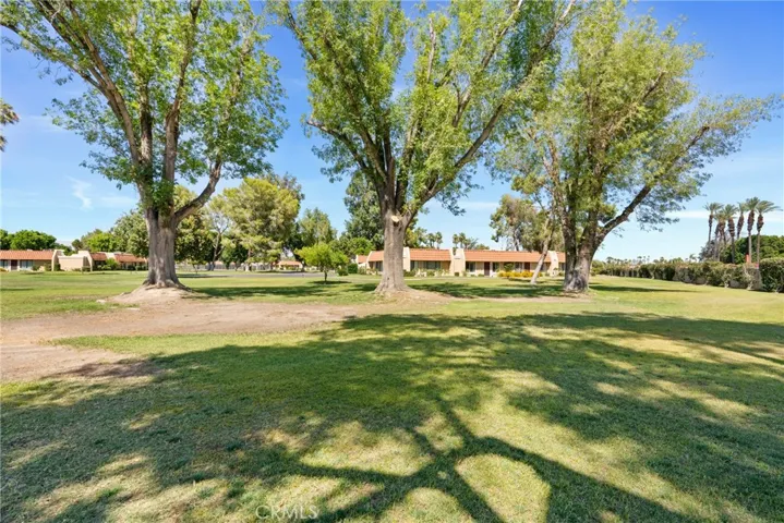 Expansive green area outside for leisure and admiration of mountain views.
