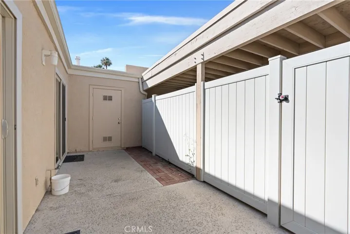 Enjoy outdoor living on your private back patio, fenced with space for BBQ and dining. Door to large exterior storage closet.