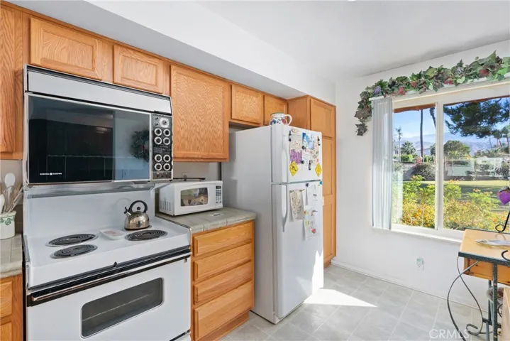 Well-equipped kitchen with plenty of countertop and cabinet space.