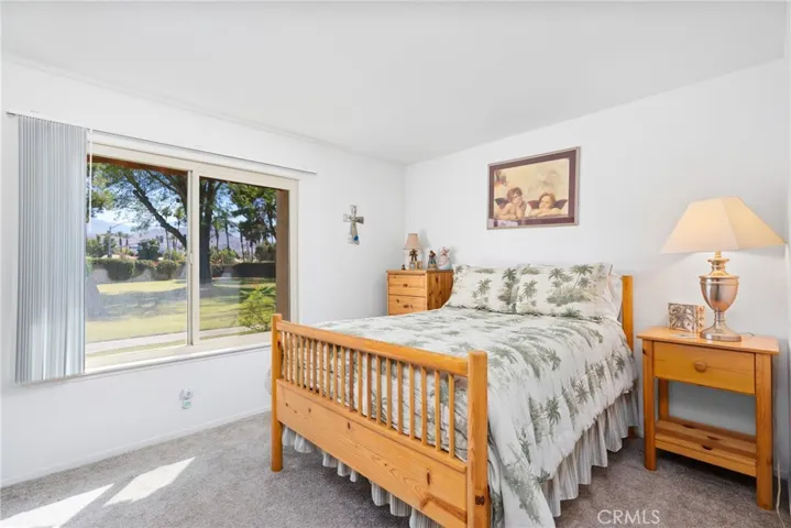 The secondary bedroom offers a snug, welcoming space, perfect for guests or family.

