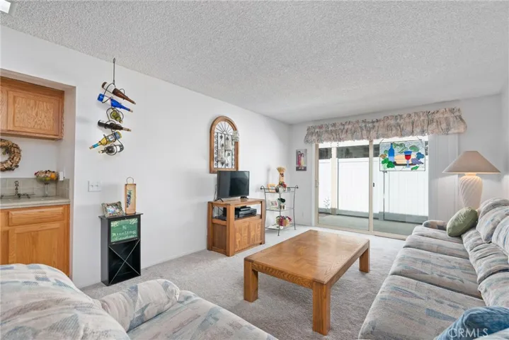 With its open layout, the living room effortlessly transitions from indoor comfort to outdoor leisure.
