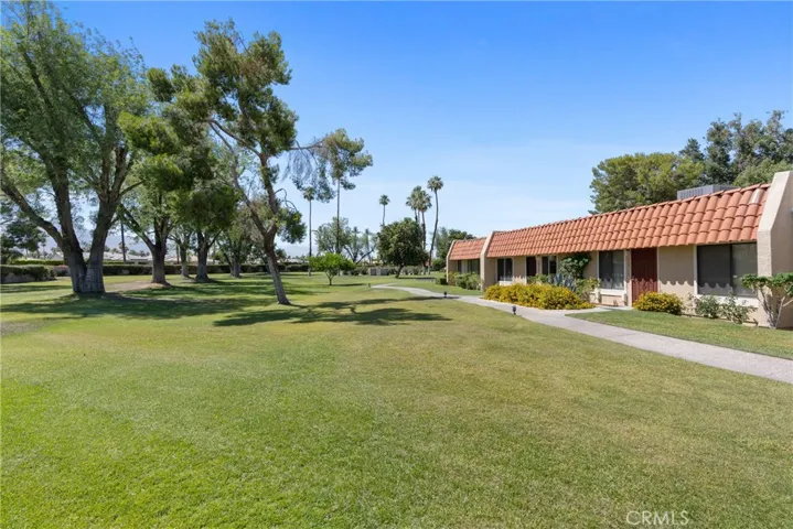Front door opens to a vast green space, perfect for play or admiring panoramic mountain views.
