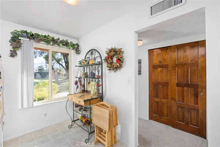 Step inside to an open layout with abundant natural light from front door to the patio.