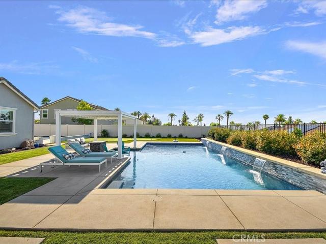Backyard has beautiful pool