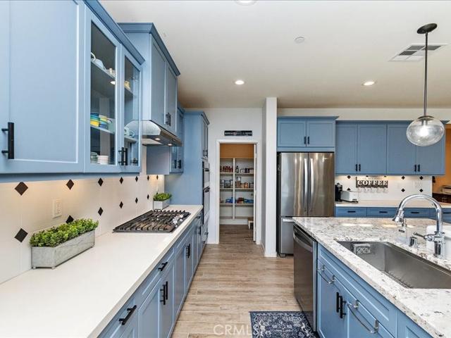 Lots of cabinets and a walk-in pantry