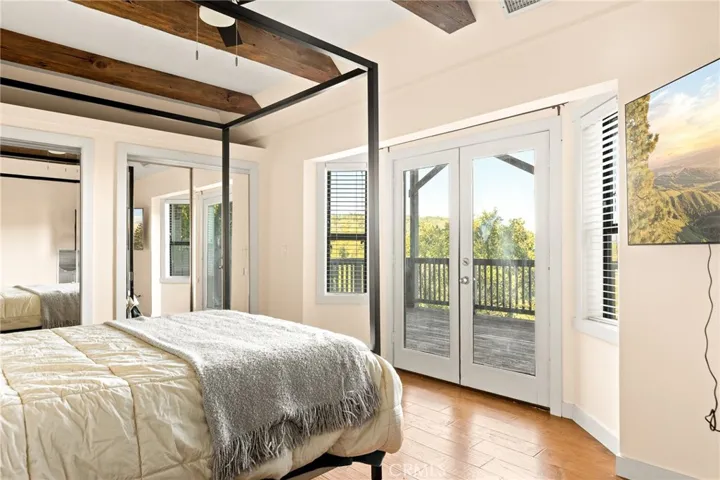 Master bedroom views with French doors leading out to 2 nd deck.