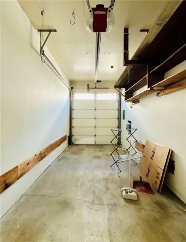Private Single Car Garage w/Storage Shelves