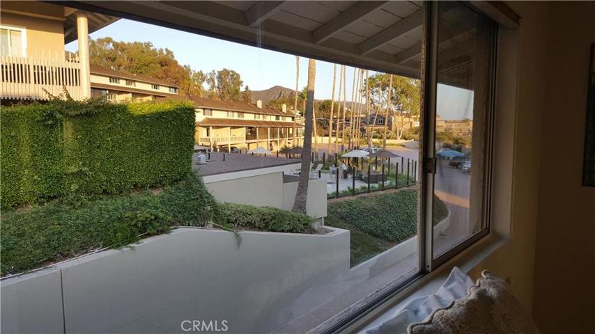 VIEW FROM GUEST BEDROOM LOOKING AT UPPER COMMUNITY POOL AREA