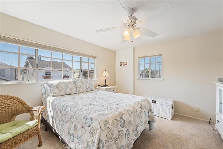 Guest bedroom upstairs with tiny view of the water