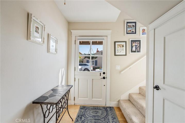 Entry, stairs to upper floor and large storage under the stairs for holidays, etc.