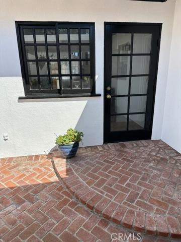 Rear door and windows from kitchen to patio
