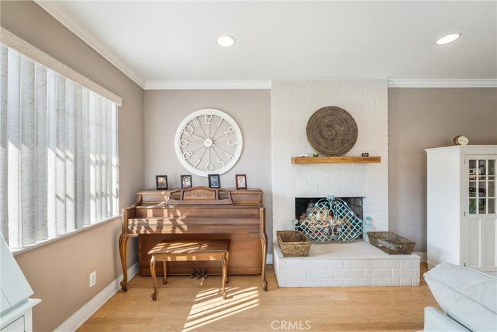 View of fireplace complete with gas logs and entertaining area