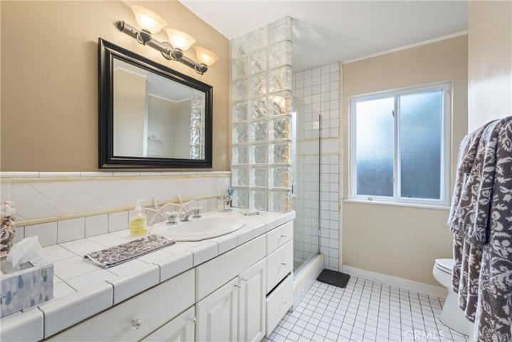 Guest bathroom with shower and hand held shower head