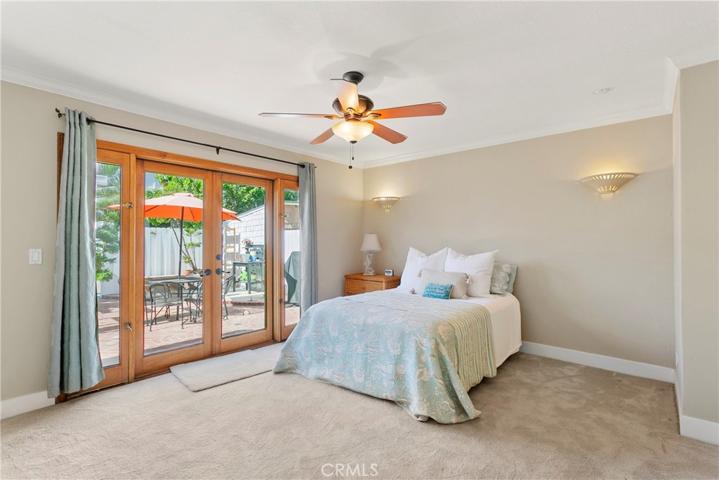 Downstairs bedroom with French Doors leading to huge patio