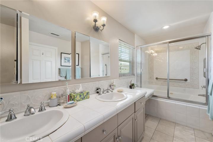 Master bath with dual sinks, Jaquizi size tub with safety grab bars