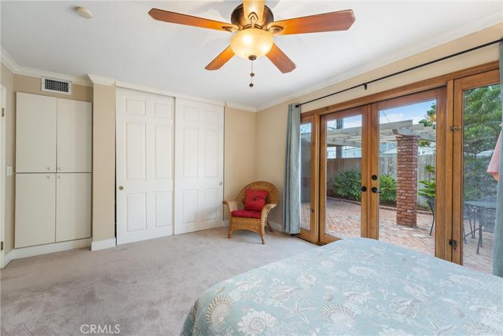 Guest bedroom with large closet and also storage area to the left