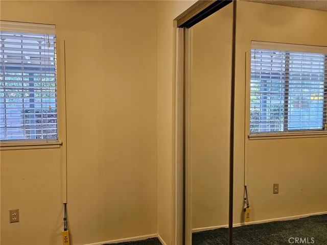 Bedroom 1 mirrored closet doors