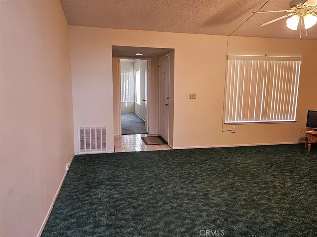 Living room towards entry and Family room