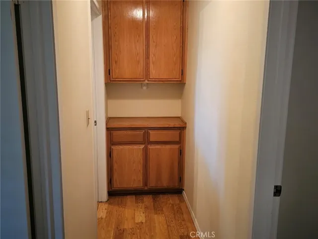 Hall linen closet and floor example of non carpet