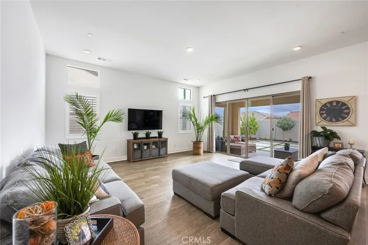 Family room with over-sized slider opens to back yard.