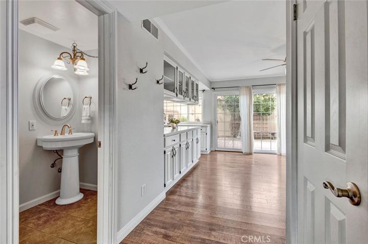 Hallway to powder room and kitchen