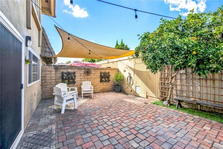 Patio leads to 2 car garage with laundry