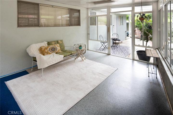 Backyard with enclosed patio room has plumbing