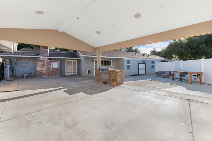 Covered patio with built in speakers and lighting plus BBQ