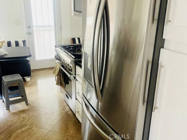 kitchen includes refrigerator